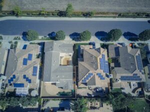 aerial view of houses with solar panels
