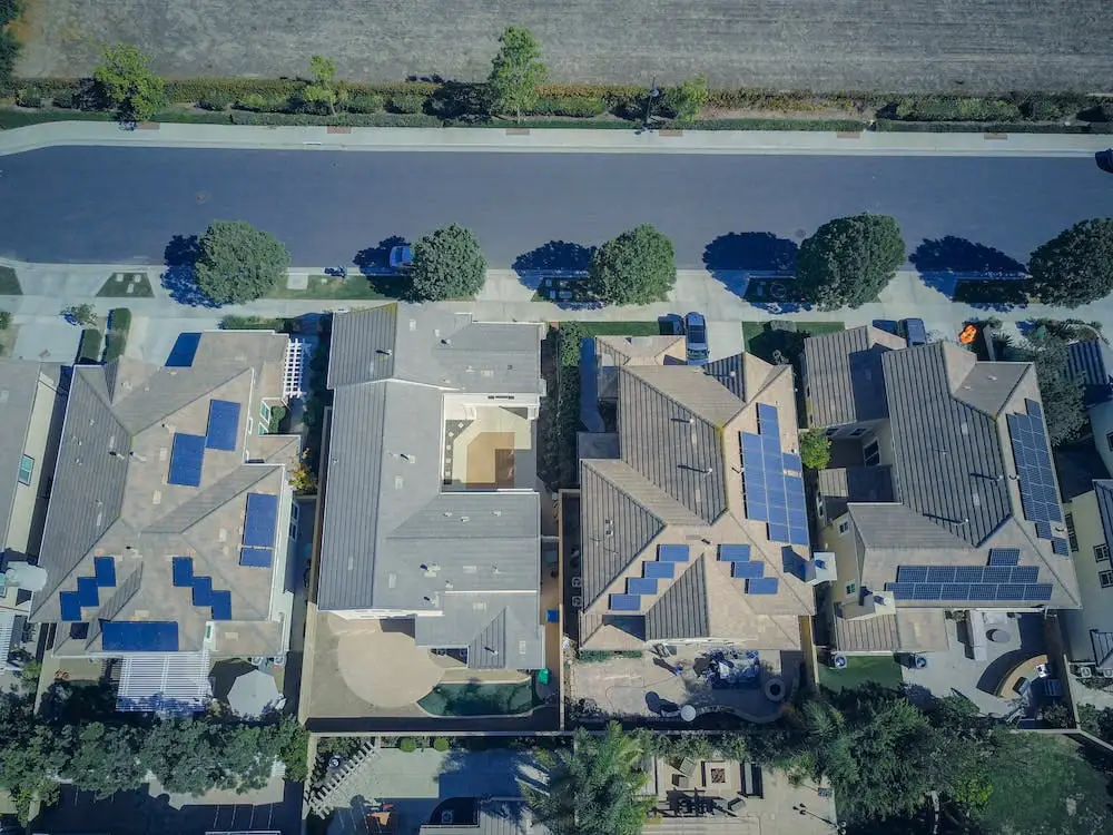 aerial view of houses with solar panels